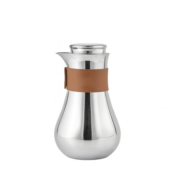 Silver carafe with a brown leather strap on a white background