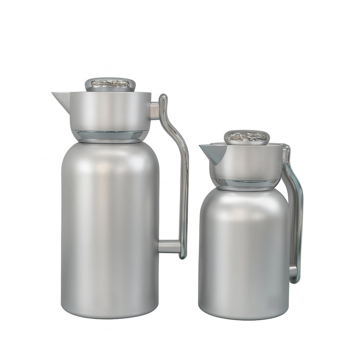 Two stainless steel carafes on a white background