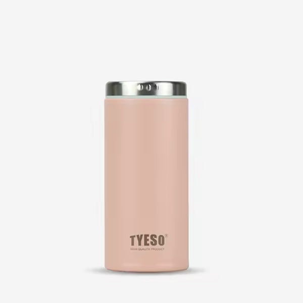 Pink insulated tumbler with silver lid on a white background