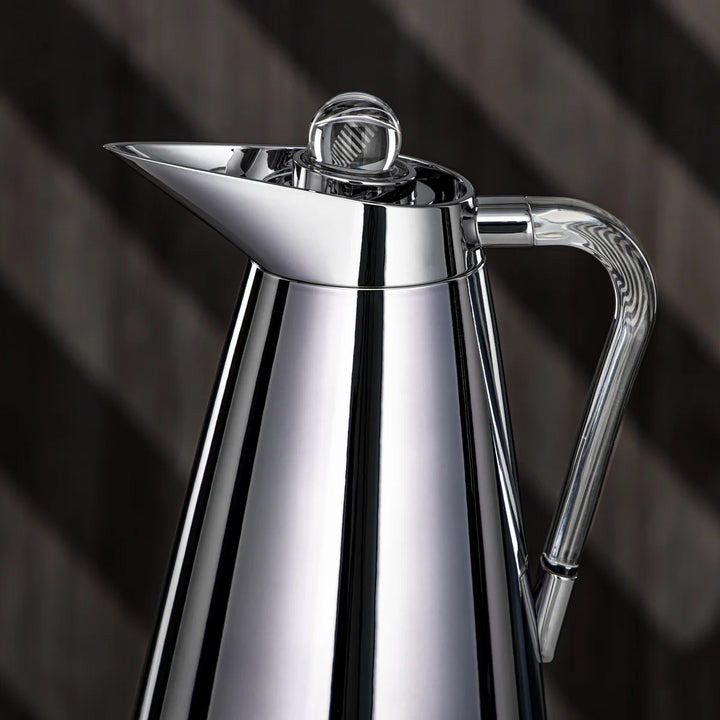 Chrome coffee pot on a dark background
