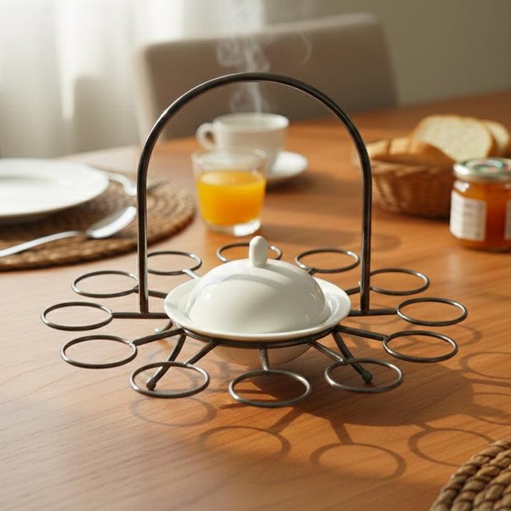 Butter dish on a decorative stand with a breakfast setting in the background