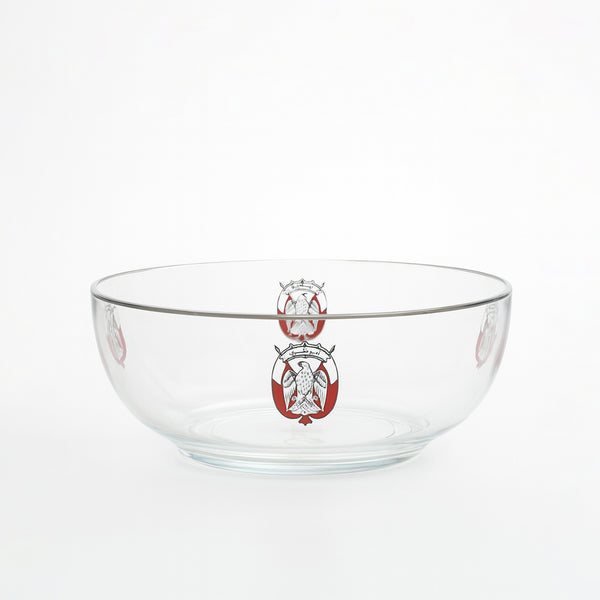 Clear glass bowl with a red and white emblem on a white background
