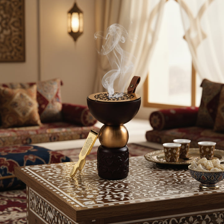 Incense burner with smoke on a decorative table in a cozy living room.